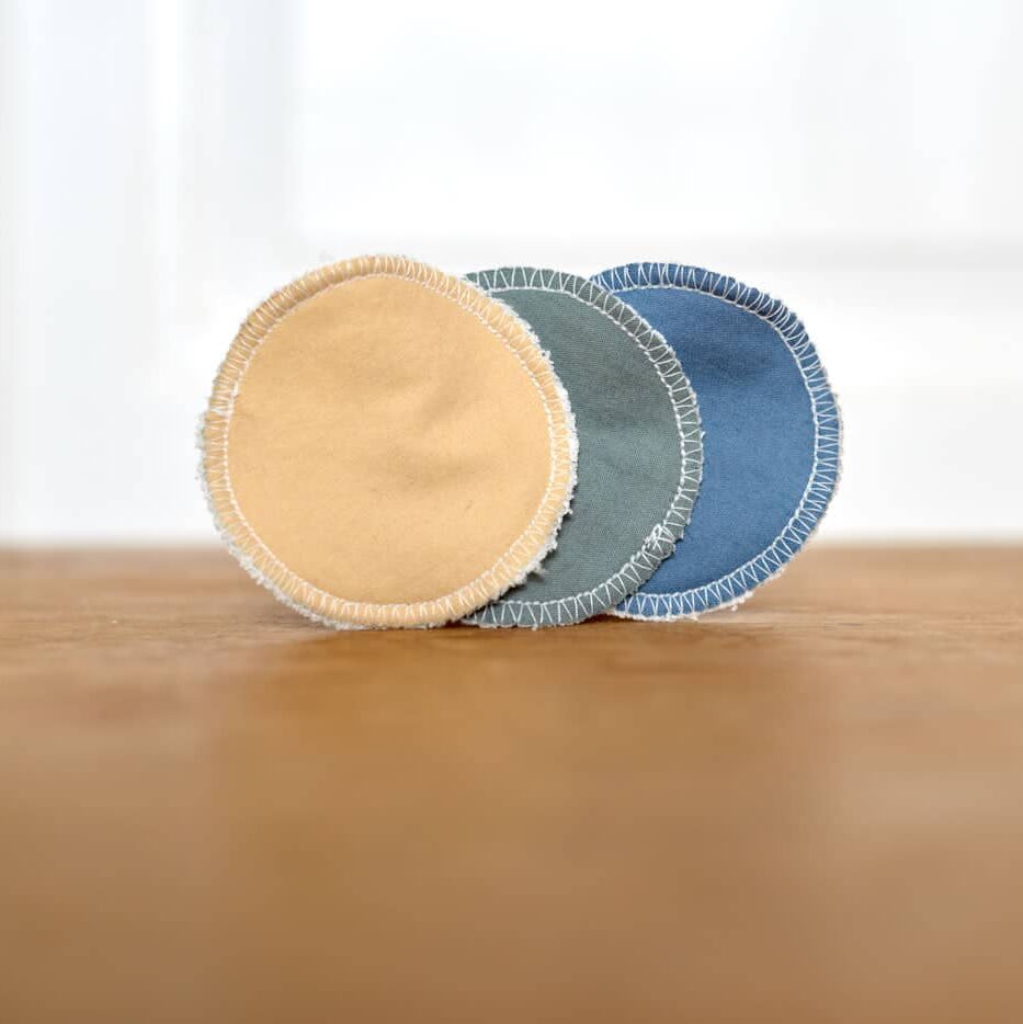 three facial round upright on a wooden surface