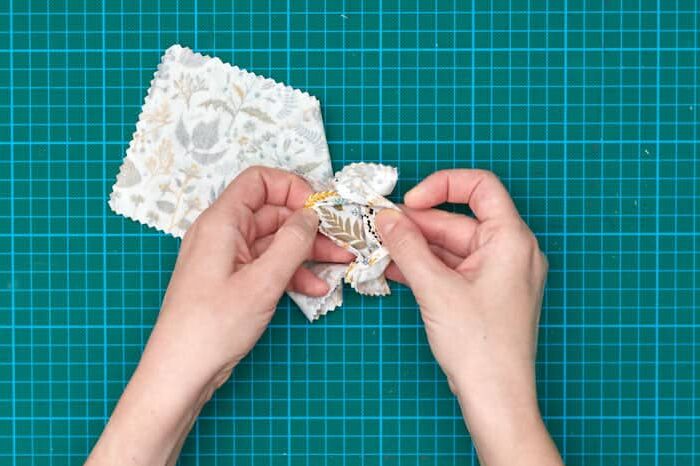 Turning eye pillow inside out on top of green cutting mat