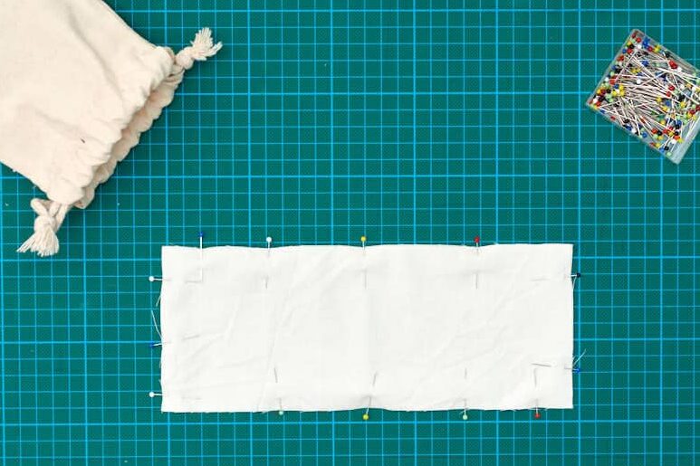 liner fabric of eyepillow pinned on green cutting mat