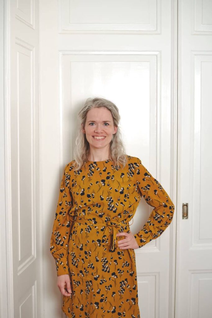 smiling woman in front of white background