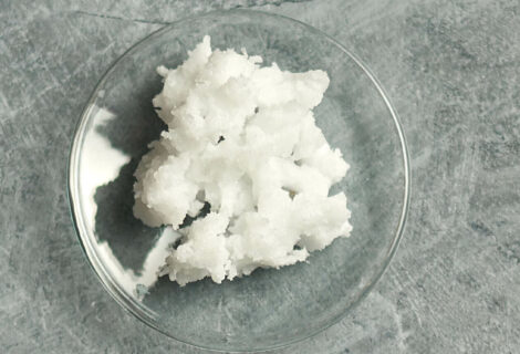solid coconut oil on a small glass dish